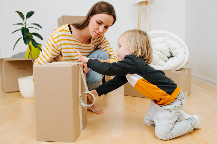mother and child packing up boxes