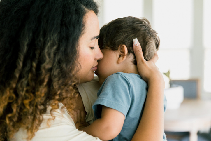mother hugging child