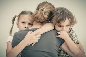 Mom hugging kids